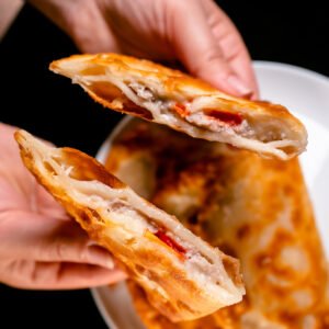 Pork, cheese, and tomato chebureki